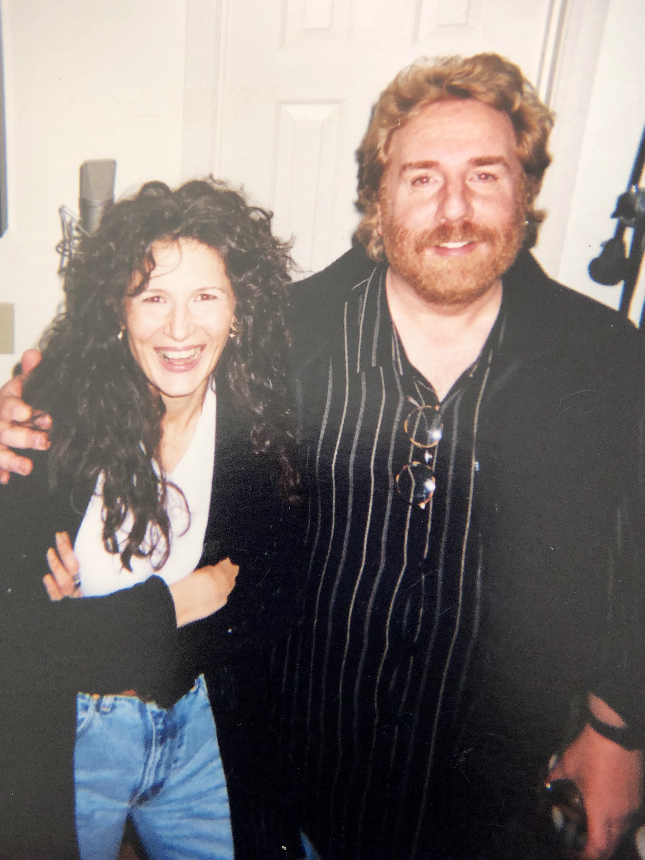 Laurie Kerr with a musician friend on stage